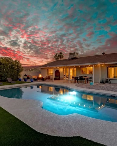 Pool and patio at dusk at a Desert Pine Stays golf home in Phoenix