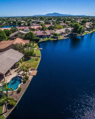 Aerial view of a lakefront Desert Pine Stays home with a heated pool in Chandler